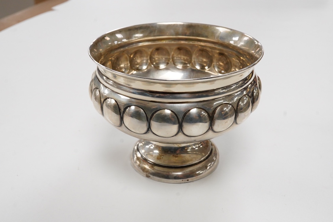 A George V silver pedestal bowl, with dimpled body, Maxfield & Sons Ltd, London, 1912, diameter 11.5cm, weighted, gross 6.1oz.